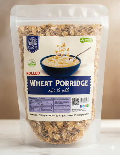 Raw rolled wheat flakes close-up, natural whole wheat grain, fiber-rich porridge ingredient for healthy meals.