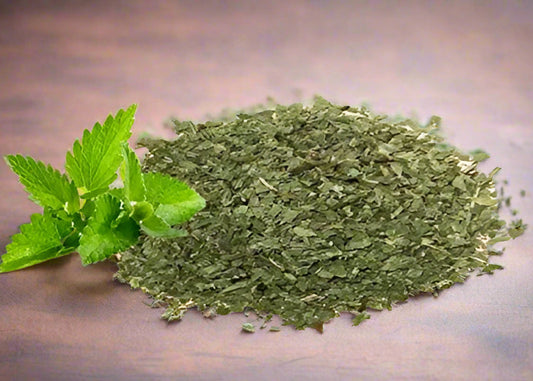 The Plants Mall resealable stand-up pouch of organic dried mint leaves showing product details, certifications, and vibrant green leaf content.